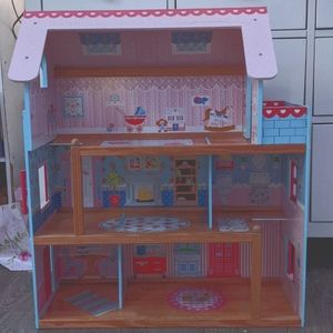 Three-story dollhouse with balcony